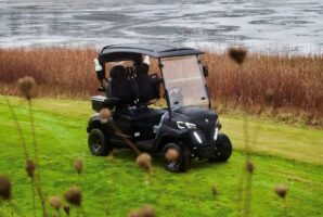 a person sitting on top of a grass covered field
